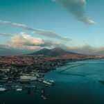 Stunning aerial panorama of Naples, Italy, showcasing the vibrant port and iconic Mount Vesuvius.