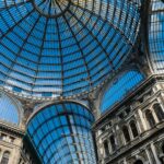 Captivating view of the Galleria Umberto I's glass dome in Naples, Italy showcasing architectural elegance.